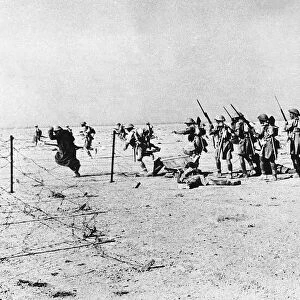 WW2 British troops train in Libya by crossing barbed wire defences in preparation of