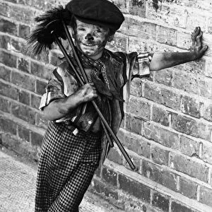 Four year old chimney sweep Tommy Stafford in fancy dress to celebrate the 100th