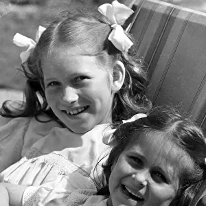 Young girls sitting in deck chair c. 1945 P044482