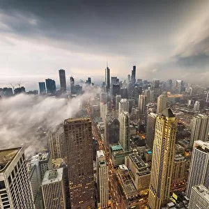 Chicago, Illinois, USA skyline from above with storm clouds and fog rolling in