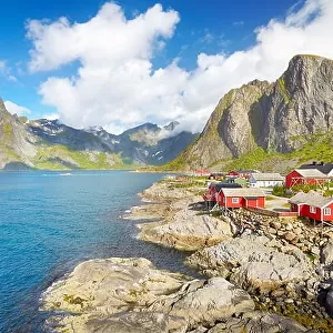 Traditional red wooden fishermen`s huts rorbu, Lofoten Island landscape, Norway