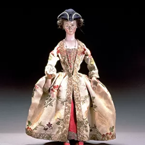 Eighteenth century doll made in Venice with the head in wood and the body in leather. The precious dress complete with three-cornered hat illustrates the style of the times