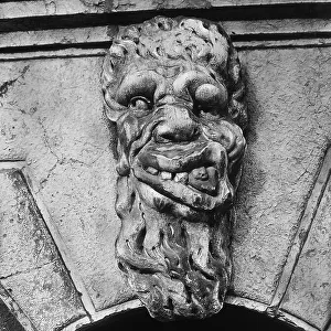Grotesque mask over the doorway of the bell tower of the Church of Santa Maria Formosa in Venice