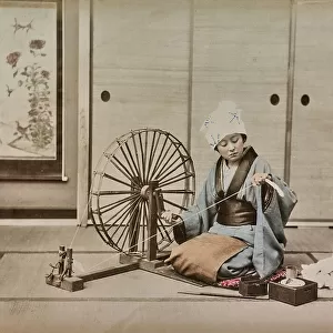 Young japanese woman while use the spinning wheel