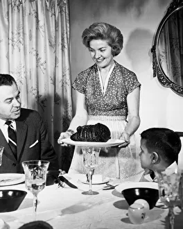 Homemaker serving dinner