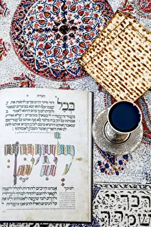 Passover Seder Haggadah in a Jerusalem jewish home, with wine and matsa Passover Seder Haggadah in a Jerusalem jewish home, with wine and matsa