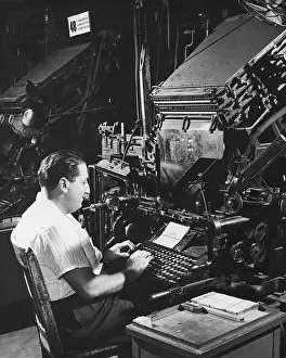 Typesetting machine operator at machine